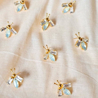 White and opal gold bug ear studs with brass, faux opal navette center and 18K rhodium gold finish