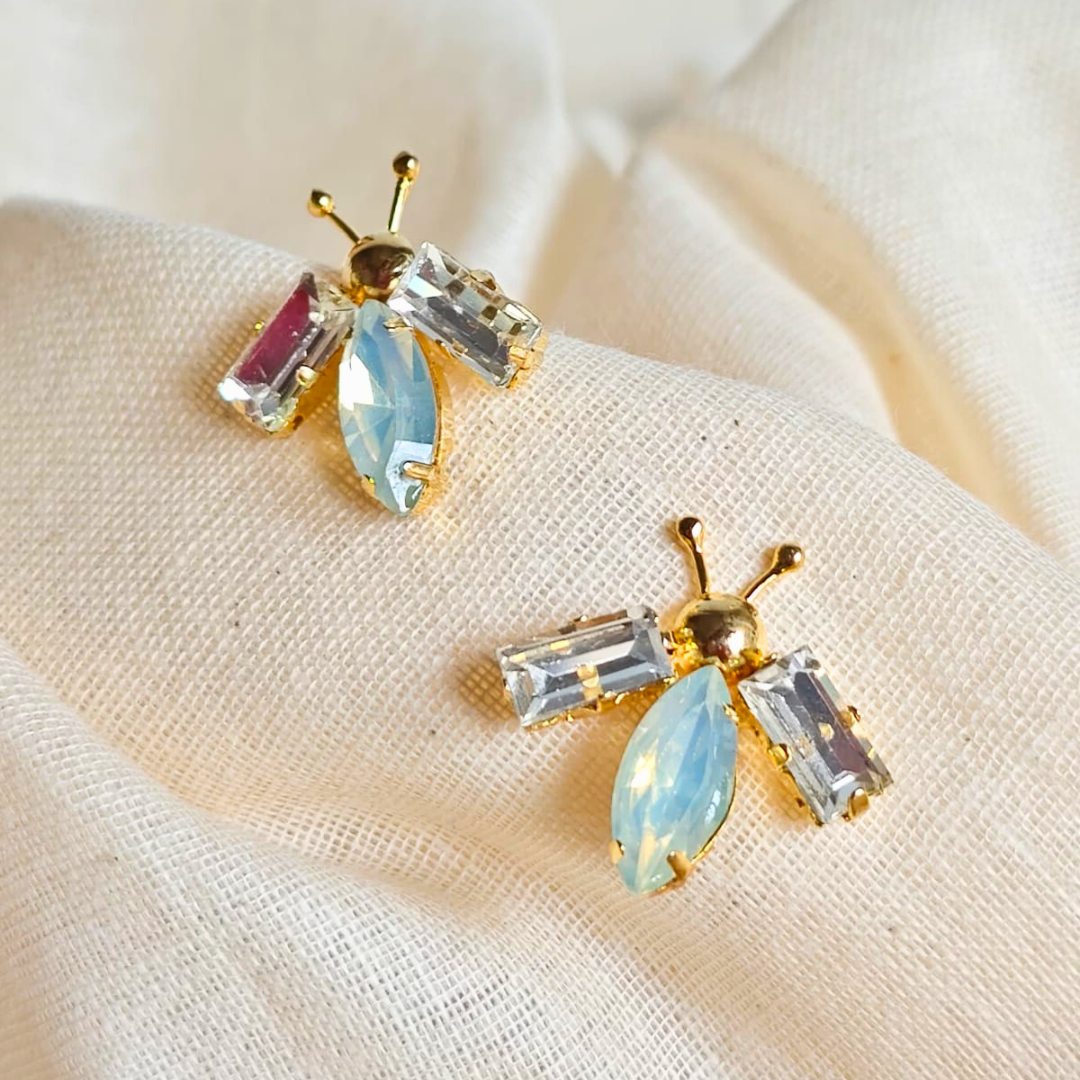 White and opal gold bug ear studs with brass, faux opal navette center and 18K rhodium gold finish