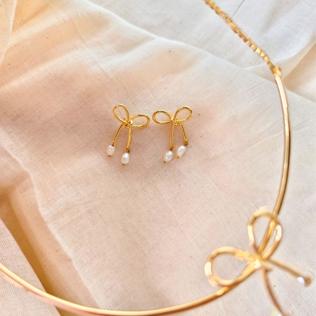 18K rhodium gold-plated bow earrings with dangling twin baroque pearls
