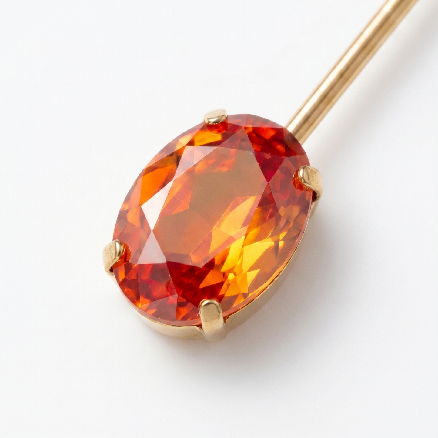 Close-up of faceted orange CZ cubic zirconia stone in gold prong setting – KANSYA earring detail