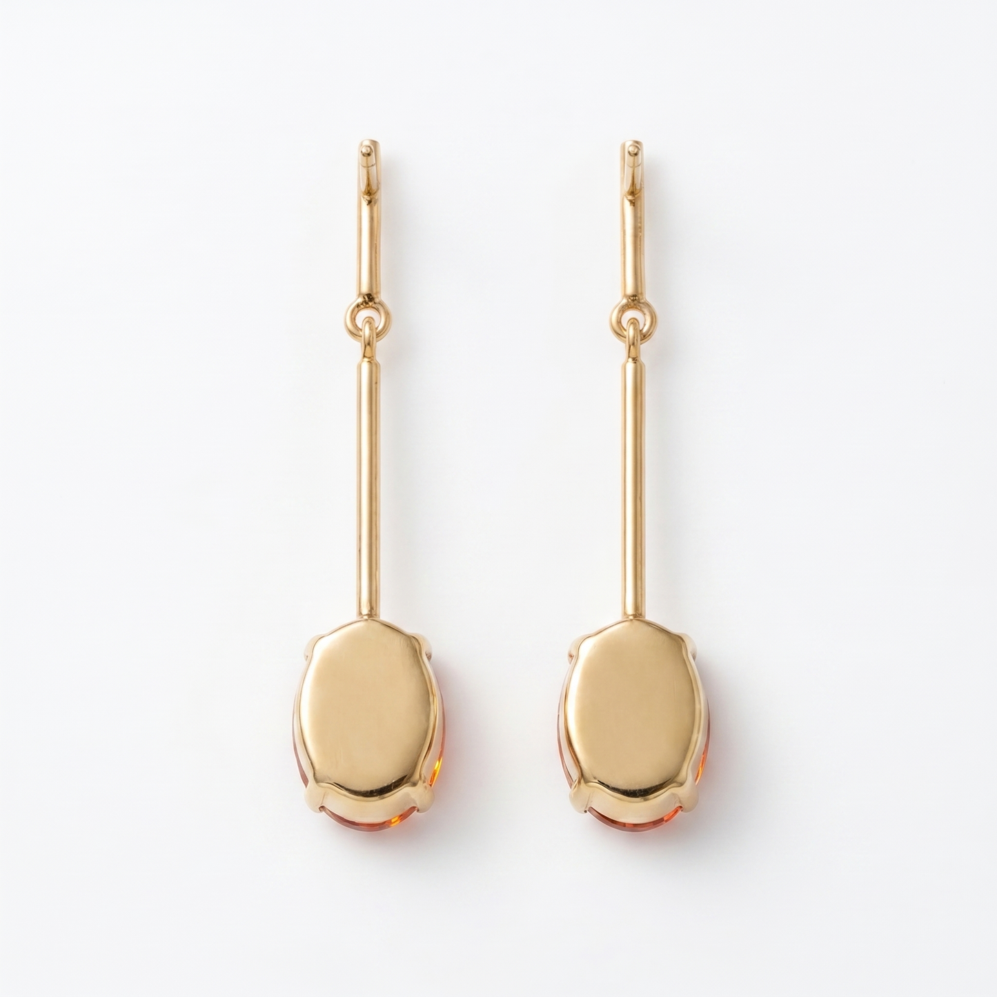 Back view of orange oval CZ gold bar drop earrings showing polished closed gold setting – KANSYA
