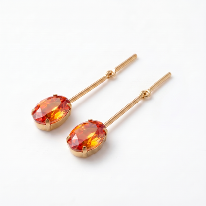 Side view of orange CZ gold bar drop earrings showing decorative knot detail and claw setting – KANSYA