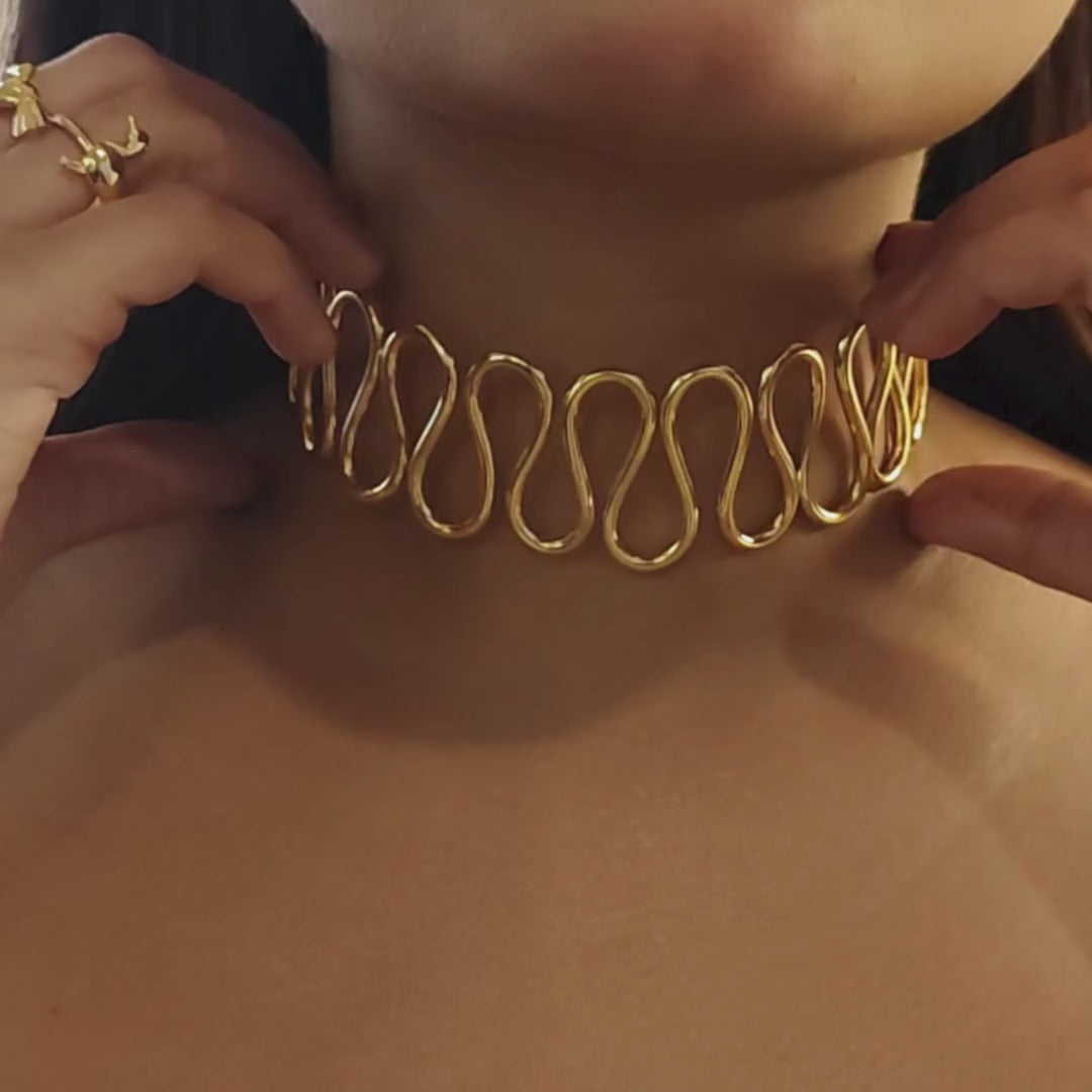Gold-plated Spiral Cuff Necklace crafted from brass, featuring a continuous wave-like design