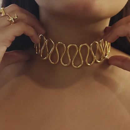 Gold-plated Spiral Cuff Necklace crafted from brass, featuring a continuous wave-like design