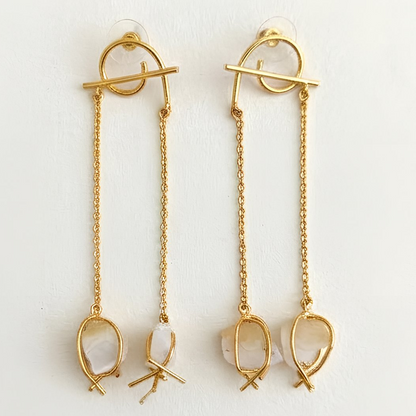 Front view of handmade semi-precious white druzy stone dangler earrings in a contemporary gold finish